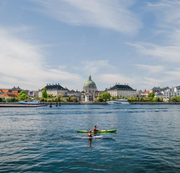 Kayaks in front of Amalienborg Castle in the harbour of Copenhagen, Denmark