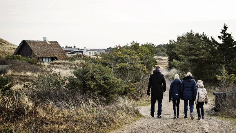 A family in a holiday cottage in Søndervig during the off-season.