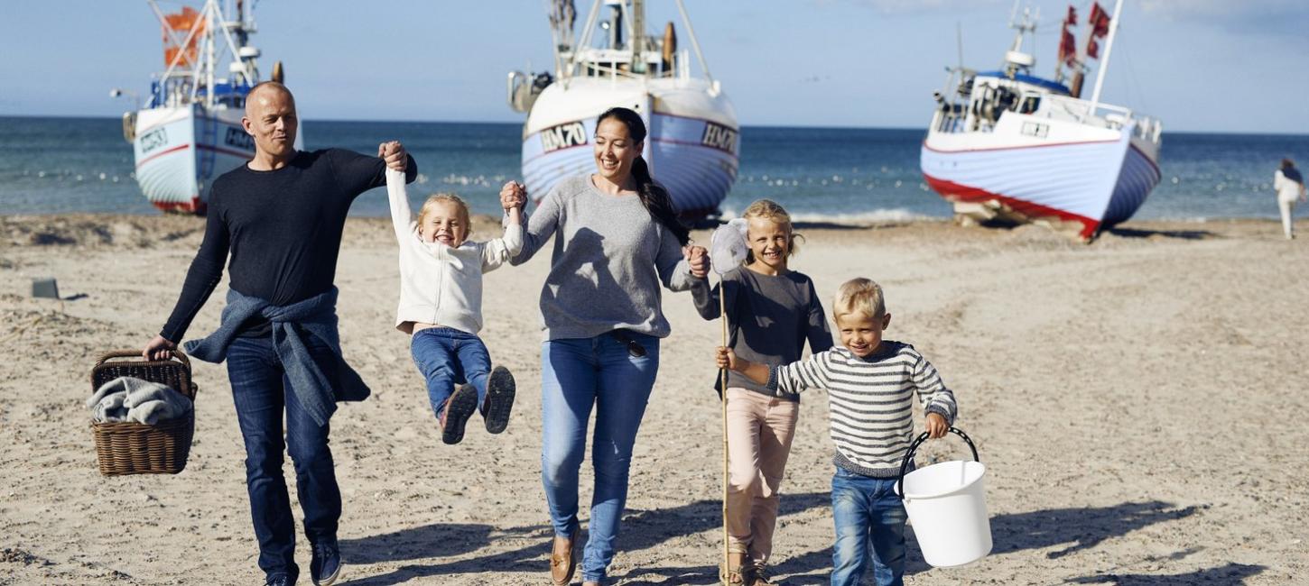 Family playing at Thorup Beach