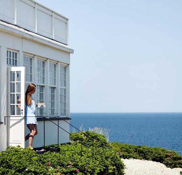 A woman walks out of Helenekilde Badehotel in North Zealand, Denmark