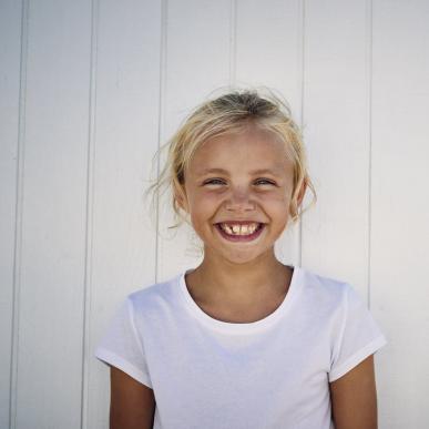 Girl smiling at beach in North Jutland, Denmark