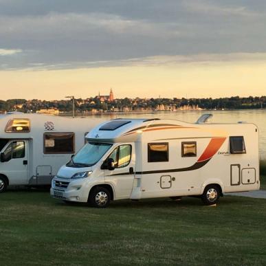 Campers in front of the water, Fjordlandet, Roskilde