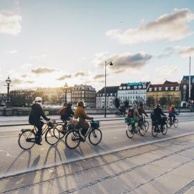 People cycling on Queen Louise's Bridge in winter, Copenhagen