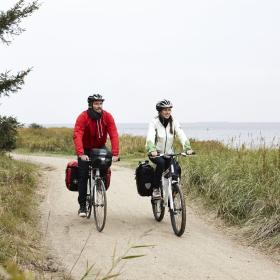 Couple cycling on the West coast cycling route (N1)